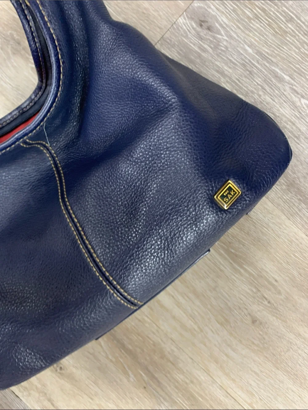 The Sak Navy Leather Shoulder Bag with Red Lining